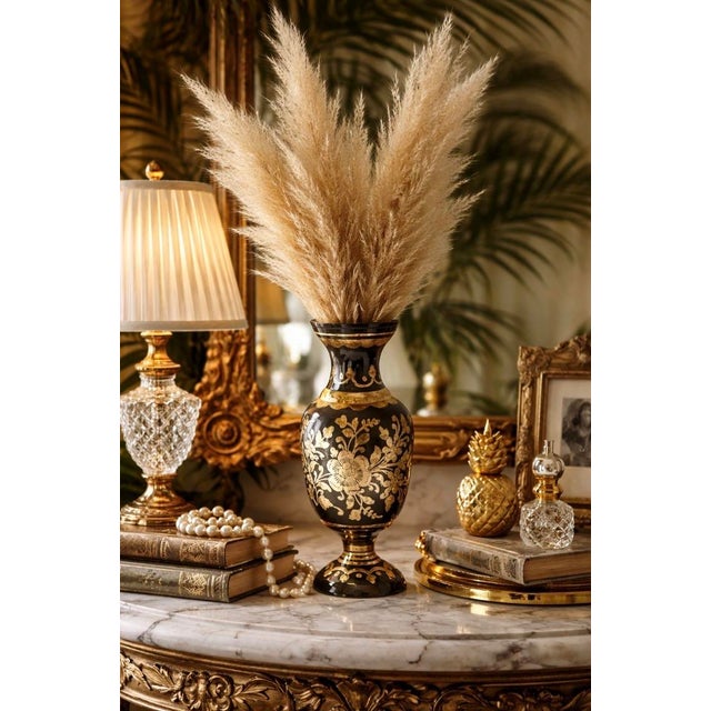 A striking vintage brass overlay vase crafted in India, featuring intricate hand-etched floral motifs against a deep black...