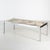 Angular shaped coffee table with chrome legs and marble top from the 1970s. with some surface scratches and wear on the...