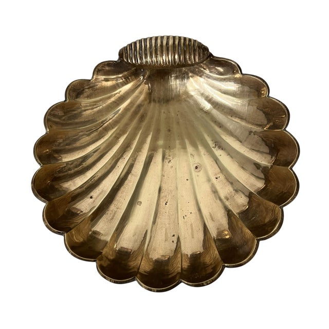 Vintage brass scalloped shell catchall. Great place for keys, change and other small items. Measures 7” x 7” x 2” h. Made...