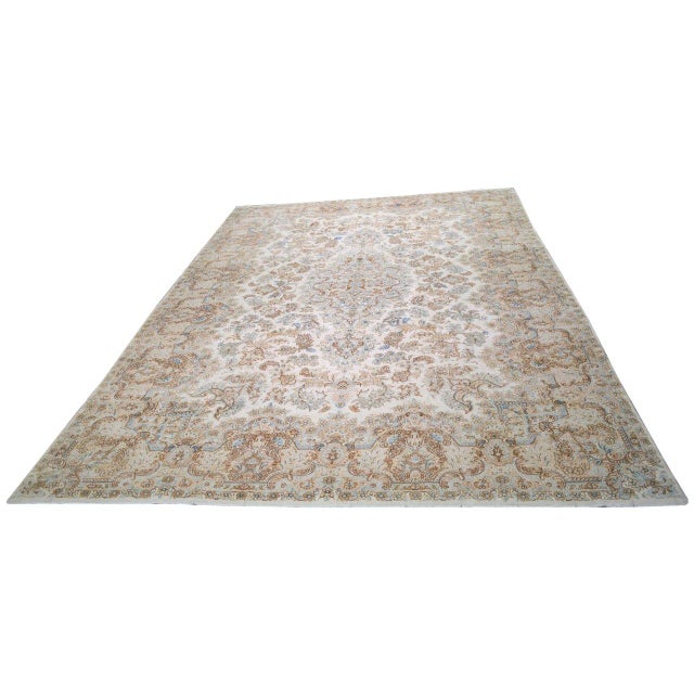 Hand-knotted with care using traditional rug-making techniques, this wool rug blends timeless craftsmanship with a modern...