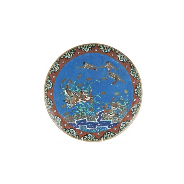 An antique Japanese copper interior plate or charger with cloisonne enamel design. Meiji period The central part of the...