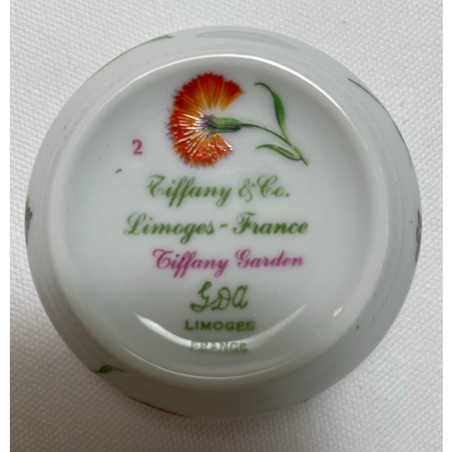 Beautiful Tiffany & Co. round porcelain box in the "Tiffany Garden" design, made by Limoges in France. 2" Dia x 1.25"H.