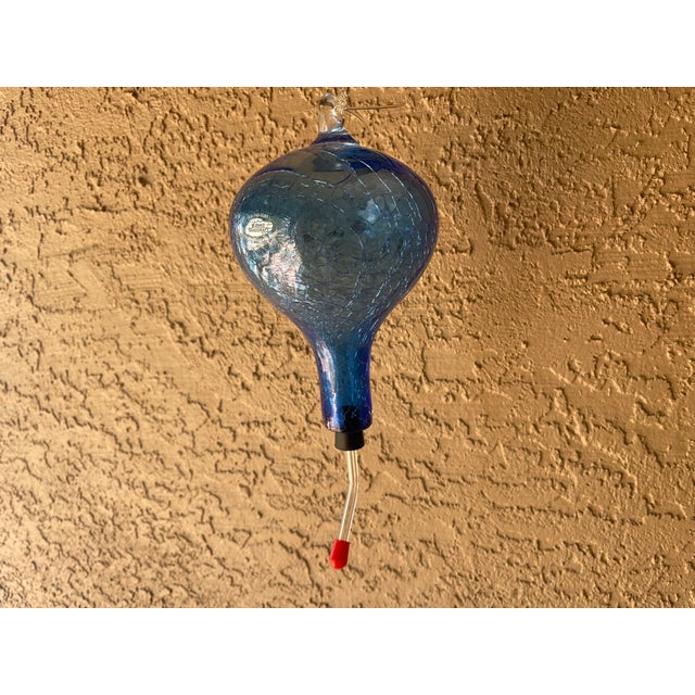 8 inch Blenko Crackle Glass Hummingbird feeder. A unique piece of handblown art glass. The crackle glass sparkles in the...