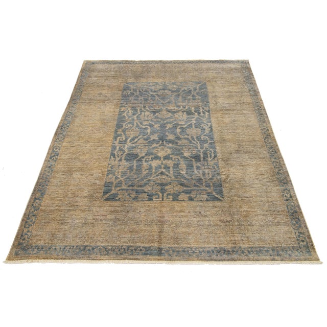 This modern Oushak-style wool rug blends contemporary design with the classic charm of traditional Oushak craftsmanship....