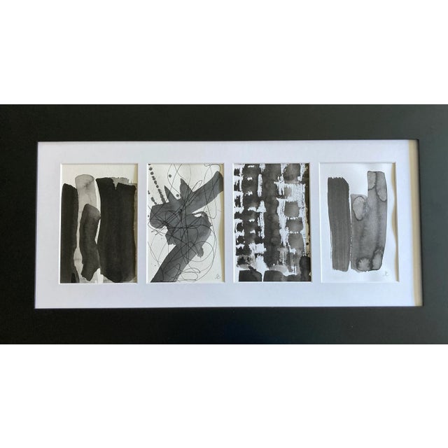 Four original black and white abstract paintings framed together. Ink on paper. Signed and framed.