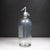 ABOUT Antique heavy glass mineral water seltzer siphon bottle with chrome plated dispensing head. Acid-etched lettering on...