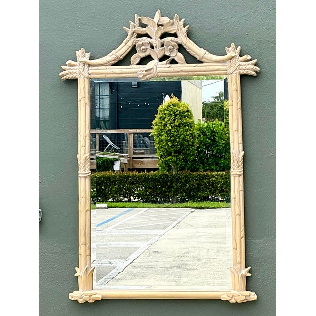 This striking vintage mirror captures the essence of Hollywood Regency glamour with a whimsical Palm Beach twist. The...