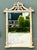 This striking vintage mirror captures the essence of Hollywood Regency glamour with a whimsical Palm Beach twist. The...