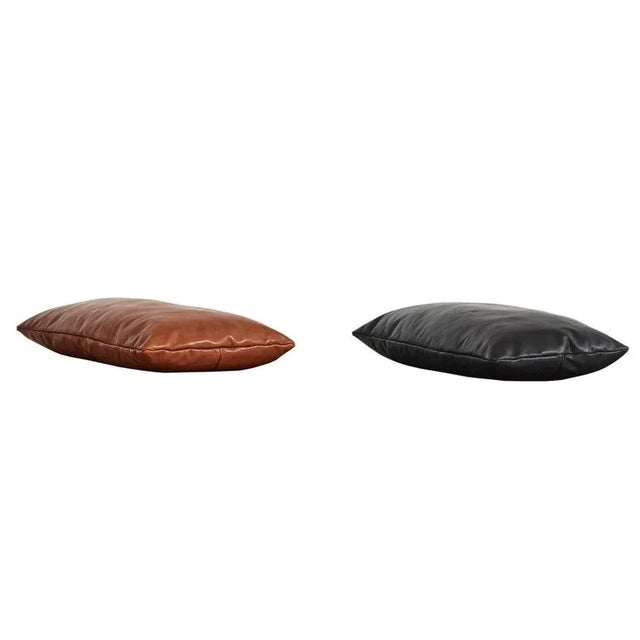Set of 2 nought / black level pillows by msds studio. Materials: camo leather. Dimensions: d 23.5 x w 67 x h 8.5 cm. The...