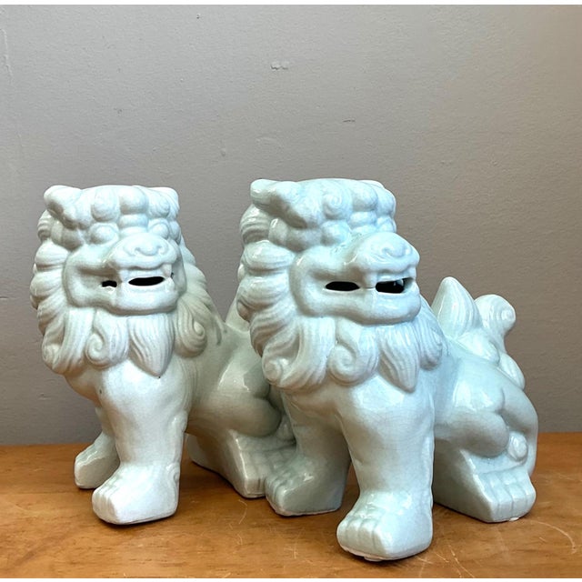 This refined pair of vintage Foo Dogs exemplifies the timeless artistry of traditional Asian ceramic design. Expertly...