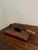 A beautiful antique French Country style hand-made wooden herb-cutting board with an iron handle and cutter. This piece...