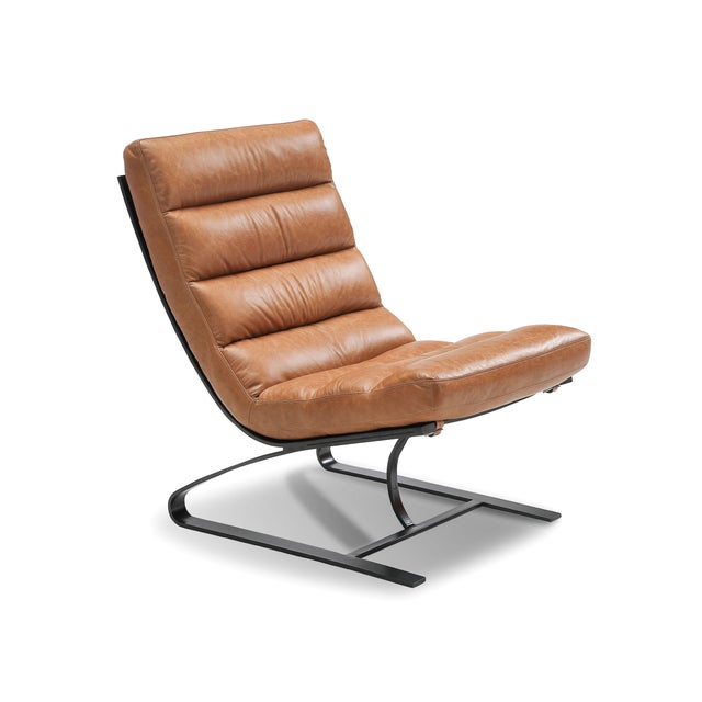 The Lavello Chair and Stool Set from Zentique is a sleek cantilever lounge chair in warm Columbia brown top grain leather....