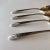 1939 set of 4 silver plated tea spoons 6"L , makers mar reads " Crown Silver plate " Radiance Pattern , they are in very...