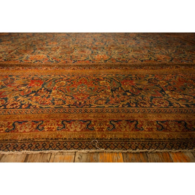 The Kashan is a classic Persian city rug featuring a high-density, curvilinear design with a central floral medallion and...