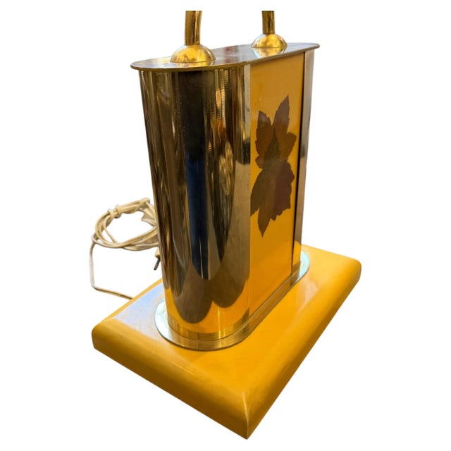 This authentic 1970s Mid-Century Modern Italian table lamp, produced by Old Gift, pairs rich yellow lacquered wood with...