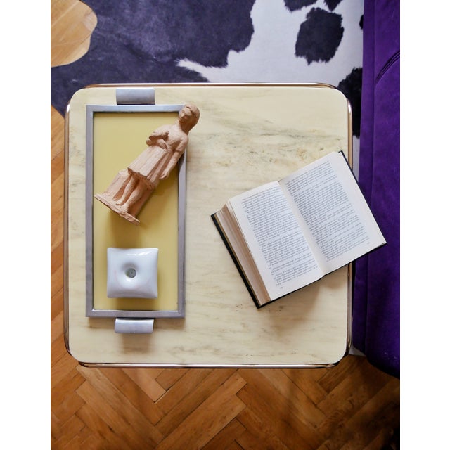 Hollywood regency style coffee table, combination of brass and marble. Classic interior piece.