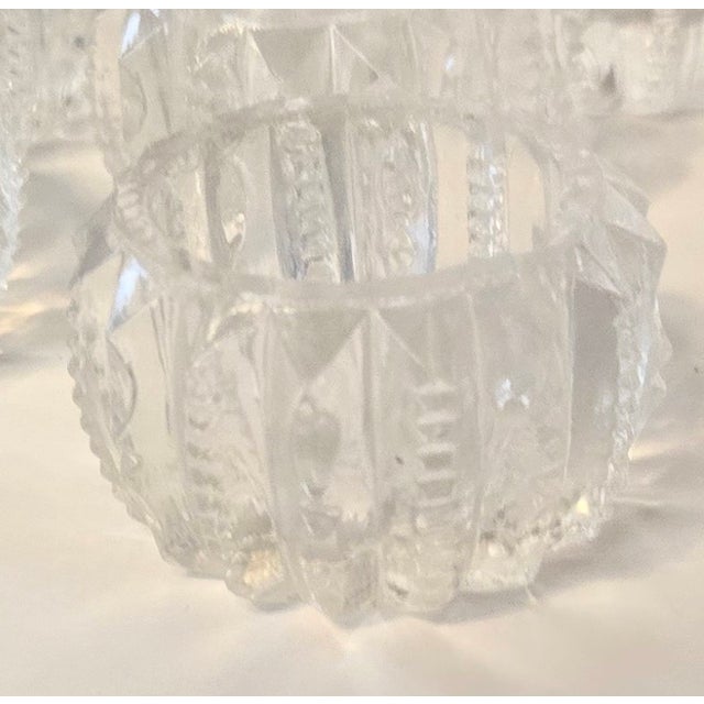 A full dozen perfect glass salt cellars ready for formal table or however you want.