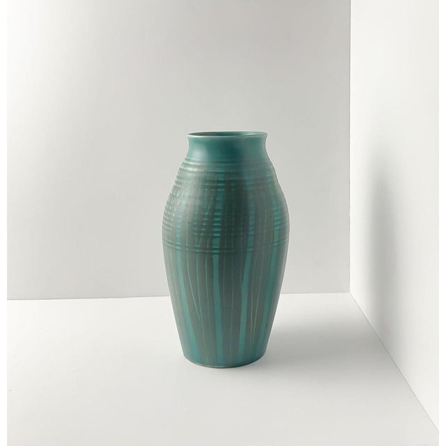 Designed by colin melbourne and produced by beswick, england, this mid-century modern ceramic vase dates to the 1950s. The...