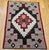 Early 20th-century Navajo area rug, handwoven in the American Southwest, this piece is a striking example of traditional...