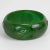 This is part of Chairish’s Costume Jewelry assortment. This is a stunning basil green marble Bakelite carved bracelet...