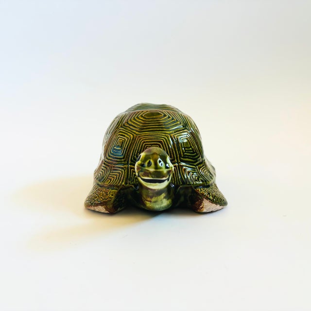 A hand made vintage mid century ceramic turtle. Lovely green and brown glazes. Signed by the maker "Santos" on the base...