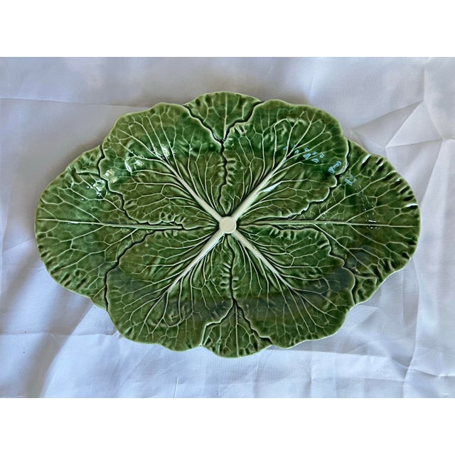 Vintage Bordallo Pinheiro green and white glazed oval cabbage serving platter. Measures 14.5” wide, 20” deep and 1.5”...