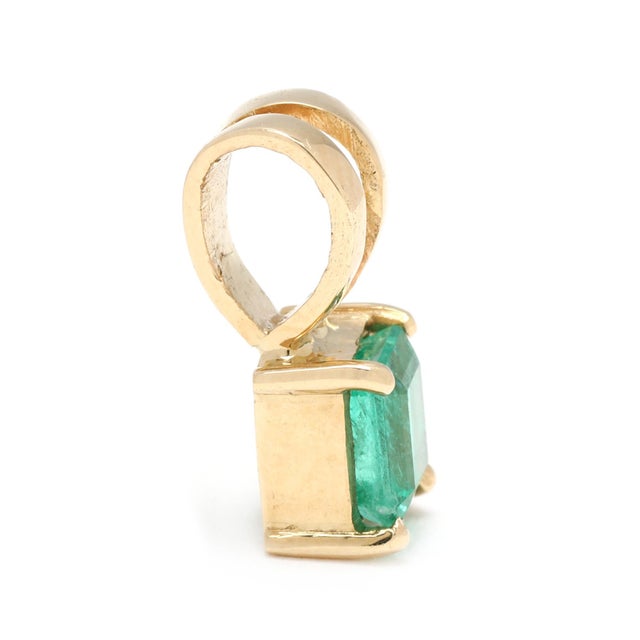 Stone: emerald, 1 stone square emerald cut approximately .30 carat Length: 12.8 mm Width: 5.6 mm Weight: .7 dwts. / 1.1...