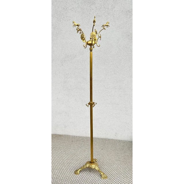 Very nicely ornamented standing brass coat rack with horses and suns. I estimate the age to be around 1970, maybe it’s...