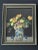 Framed vintage art print from the mid 20th century features a superb still life of colorful flowers in a painted ceramic...