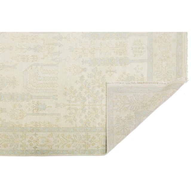 Elevate your space with this Modern Oushak style rug, inspired by timeless Turkish motifs. It showcases a “Tree of Life”...