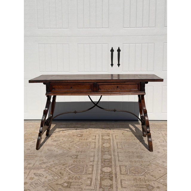 A beautiful 18th-century Spanish Baroque walnut writing desk, sourced in France. Rich in character and history, this...
