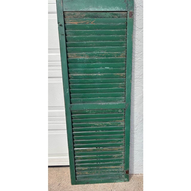 Antique American farmhouse shutter from a Pennsylvania farmhouse. Circa 1800. Lovely green color. All louvers are intact...