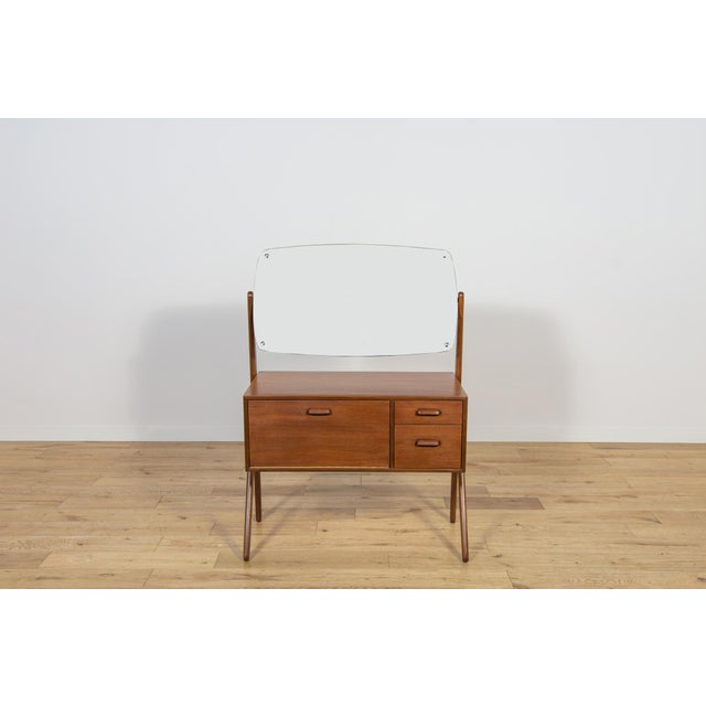 A small teak dressing table produced in the Danish factory Ølholm Møbelfabrik in the 1960s. It consists of two drawers and...
