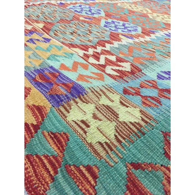 A beautiful traditional Uzbek kilim. This kilim is made of 100% wool, dyed with all natural dyes made from vegetable...