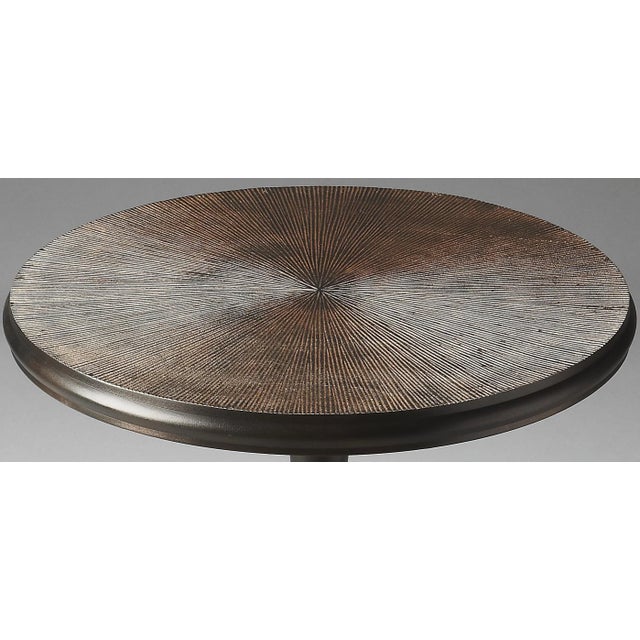 Crafted from cast aluminum in a glowing bronze finish, this Accent Table features a smooth surface up to the fluted top,...