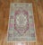 A pair of mid-20th century Turkish Anatolian rug mats with a lavender field pops of green and pink accents. One piece is 1...