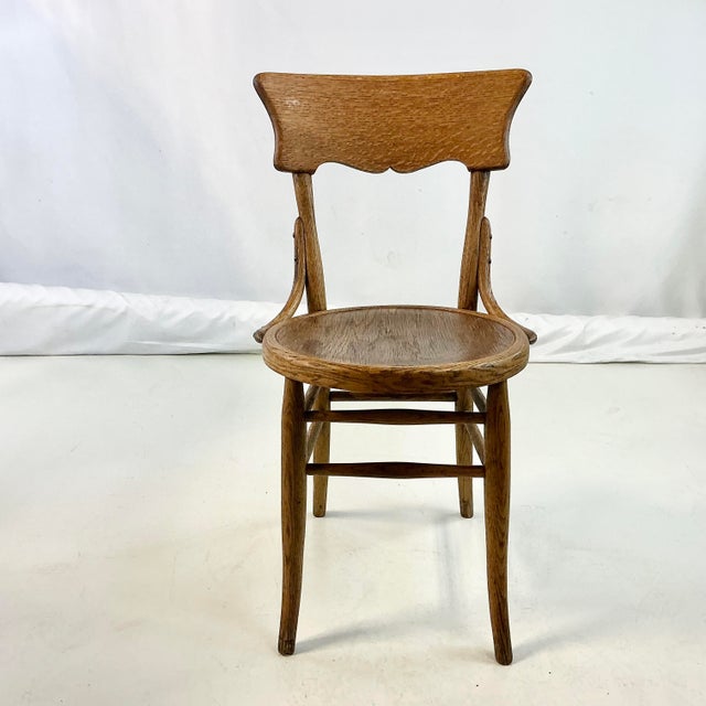 This is a lovely antique oak Bistro Dining Chair. We love the wide backrest that glares out and has a nicely scalloped...