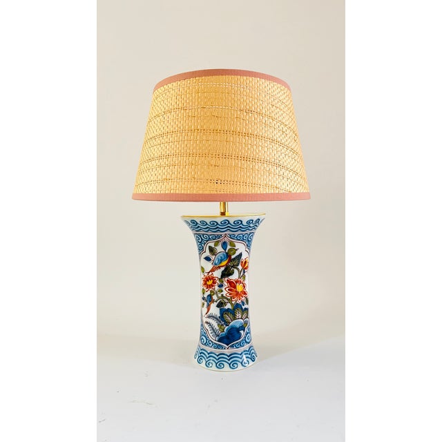 A pair of early 20th century table lamps made from rare antique flute vases by royal tichelaar makkum. Decorated on an off...