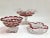 Lovely set of three cranberry cut to clear serving or display glass bowls each uniquely decorated. Great for shelf...