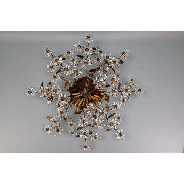 Large hollywood regency-style crystal glass, floral, and gold metal five-light ceiling lamp. a strikingly ornate ceiling...