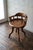 An exceptionally stylish and comfortable aesthetic movement revolving desk chair in solid walnut, combining artistic...
