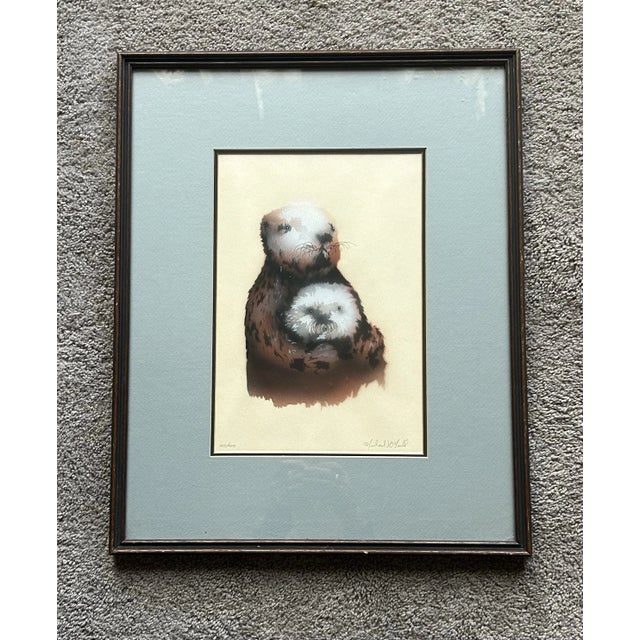 Vintage original lithograph of sea otters by listed wildlife artist Michael O’Neill. Professionally matted and framed....