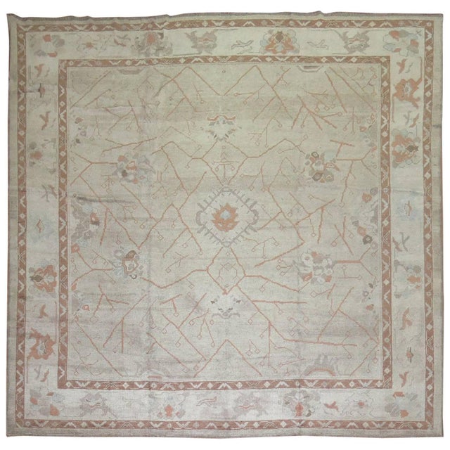 A 21st century old wool Turkish Oushak rug in gray and brown.