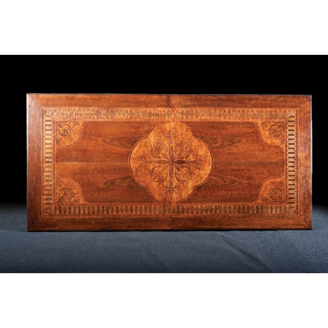 Handcrafted in Italy from solid walnut, this extension dining table features an impressive inlaid top crafted from walnut,...