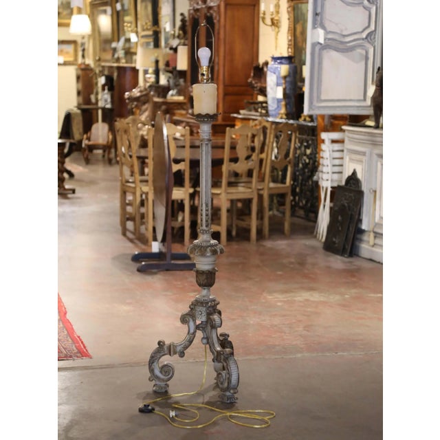 Bring dramatic scale and old-world character to a living room, library, or bedroom with this elegant antique floor lamp...