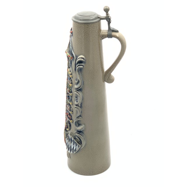 Bring the festive spirit of Bavaria into your home with this charming Maypole Stein! This delightful ceramic piece...