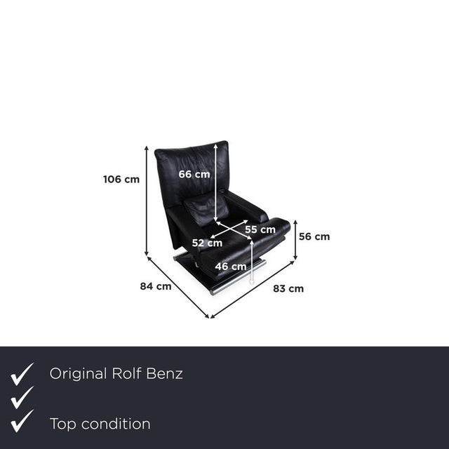 The Rolf Benz 6500 armchair captivates with its striking, cubic silhouette in black leather, creating an extremely...