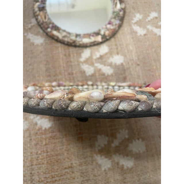 The Pair of Vintage French Coquillage Seashells Round Small Mirrors is a stylish and unique addition to any home decor....