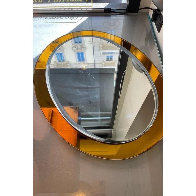 1950s wall mirror with double glass, featuring an outer frame in light blue glass and an inner border in classic clear...