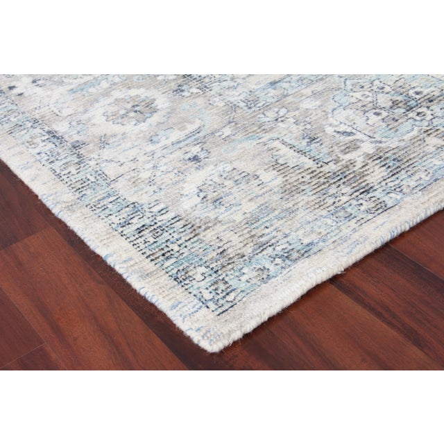 Make a statement with this dreamy accent rug. Handmade with wool and viscose, the Biron rug blends a touch of old-world...